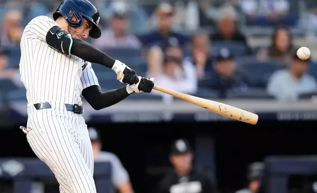 New York Yankees' Cody Bellinger hits a two-run home run during the first inning of a baseball game against the Chicago White Sox Wednesday, June 17, 2026, in New York. (AP Photo/Frank Franklin II)