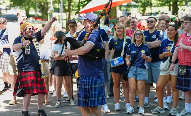Scottish fans celebrate at a park in central Boston, Mass,, ahead of the World Cup Group C soccer match between Haiti and Scotland in Foxborough, Saturday, June 13, 2026. (AP Photo/Martin Meissner)