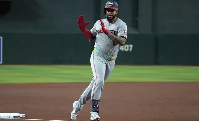 Washington Nationals' Luis García Jr. reacts after hitting a two-run home run against the Arizona Diamondbacks in the first inning of a baseball game, Friday, June 5, 2026, in Phoenix. (AP Photo/Rick Scuteri)