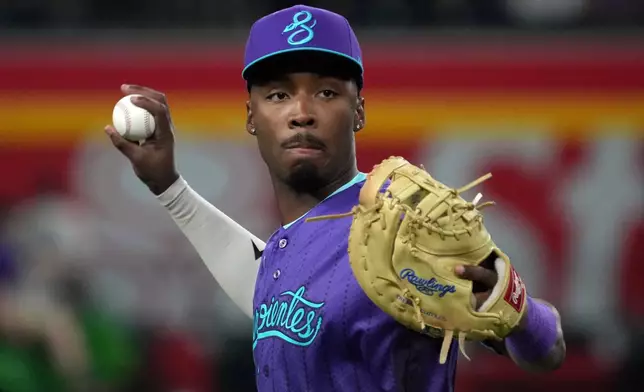 Arizona Diamondbacks first baseman Lujames Groover warms up before a baseball game against the Washington Nationals, Friday, June 5, 2026, in Phoenix. (AP Photo/Rick Scuteri)