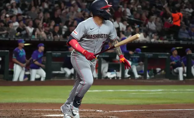 Washington Nationals' Luis García Jr. watches his grand slam against the Arizona Diamondbacks in the sixth inning of a baseball game, Friday, June 5, 2026, in Phoenix. (AP Photo/Rick Scuteri)