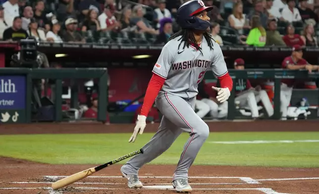 Washington Nationals CJ Abrams hits a solo home run against the Arizona Diamondbacks in the second inning of a baseball game, Sunday, June 7, 2026, in Phoenix. (AP Photo/Rick Scuteri)