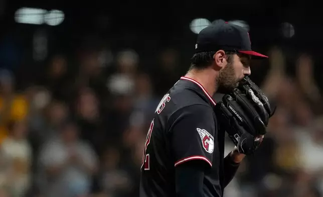 Cleveland Guardians' Gavin Williams reacts after giving up a two-run home run to Milwaukee Brewers' Jackson Chourio during the fourth inning of a baseball game Wednesday, June 17, 2026, in Milwaukee. (AP Photo/Aaron Gash)