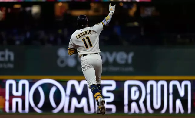 Milwaukee Brewers' Jackson Chourio gestures as he rounds the bases after hitting a two-run home run during the fourth inning of a baseball game against the Cleveland Guardians, Wednesday, June 17, 2026, in Milwaukee. (AP Photo/Aaron Gash)