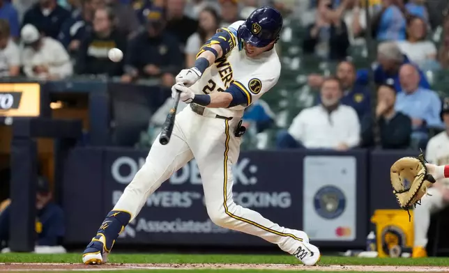 Milwaukee Brewers' Christian Yelich hits a solo home run during the first inning of a baseball game against the Cleveland Guardians, Wednesday, June 17, 2026, in Milwaukee. (AP Photo/Aaron Gash)