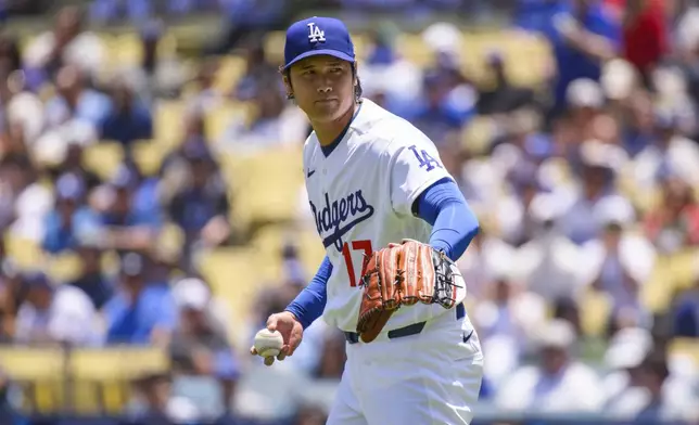 Los Angeles Dodgers starting pitcher Shohei Ohtani gestures during the second inning of a baseball game against the Tampa Bay Rays in Los Angeles, Wednesday, June 17, 2026. (AP Photo/Kyusung Gong)