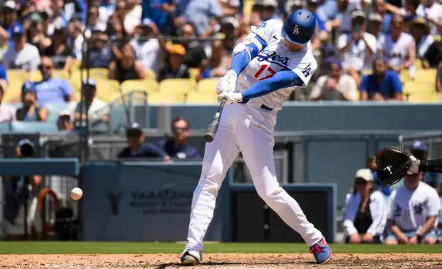 Los Angeles Dodgers' Shohei Ohtani bats during the sixth inning of a baseball game against the Tampa Bay Rays in Los Angeles, Wednesday, June 17, 2026. (AP Photo/Kyusung Gong)