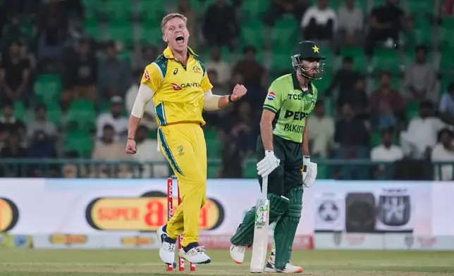 Australia's Nathan Ellis, left, celebrates after the dismissal of Pakistan's Arafat Minhas, right, during the second one-day international cricket match between Pakistan and Australia, in Lahore, Pakistan, Tuesday, June 2, 2026. (AP Photo/K.M. Chaudary)