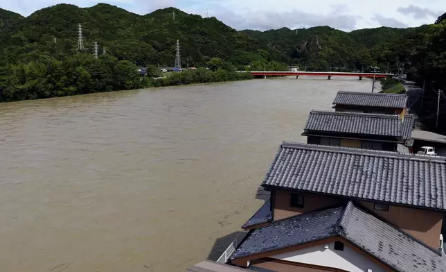 An area of the swollen Koza River is seen in Kozagawa town, Wakayama prefecture, central Japan, Wednesday, June 3, 2026, following a severe weather system in the area. (Tatsuya Sugawa/Kyodo News via AP)