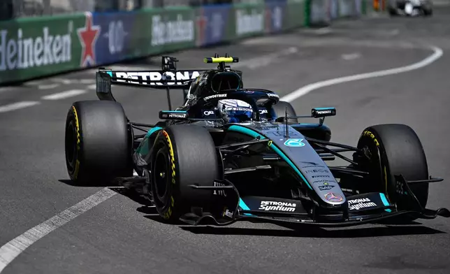 Italy's Andrea Kimi Antonelli steers his Mercedes during the Formula One Monaco Grand Prix race at the Monaco racetrack, Sunday, June 7, 2026. (AP Photo/Philippe Magoni)