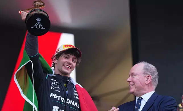 Mercedes driver Andrea Kimi Antonelli, of Italy, celebrates on the podium after winning the Formula One Monaco Grand Prix race at the Monaco racetrack, Sunday, June 7, 2026. (AP Photo/Fatima Shbair)