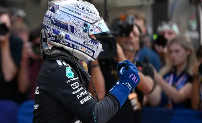 Mercedes driver Andrea Kimi Antonelli of Italy celebrates after setting the pole position during the qualifying session for the Monaco F1 Grand Prix, at the Monaco racetrack, Saturday, June 6, 2026. (AP Photo/Philippe Magoni)