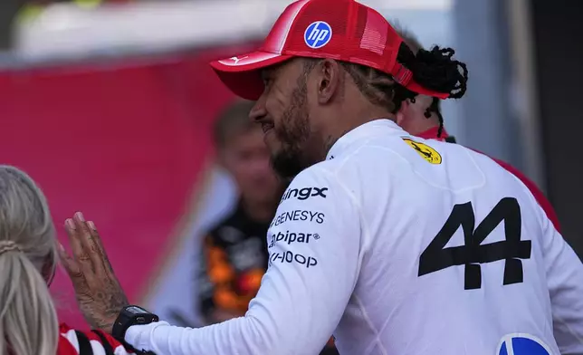 Ferrari driver Lewis Hamilton of Britain smiles after the qualifying session for the Monaco F1 Grand Prix, at the Monaco racetrack, Saturday, June 6, 2026. (AP Photo/Fatima Shbair)