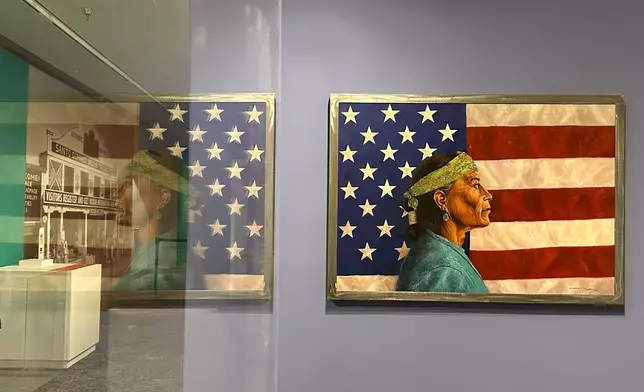A painting by Navajo artist Kee Yazzie is displayed as part of the "Stars, Stripes and First Americans" exhibition at the Museum of Indian Arts and Culture in Santa Fe, N.M., on Monday, May 11, 2026. (AP Photo/Susan Montoya Bryan)