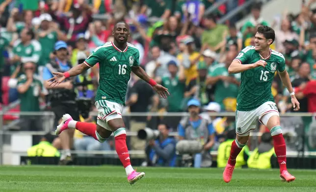 Mexico's Julian Quinones (16) celebrates with Israel Reyes after scoring their opening goal against South Africa during the World Cup Group A soccer match between Mexico and South Africa in Mexico City, Thursday, June 11, 2026. (AP Photo/Eduardo Verdugo)
