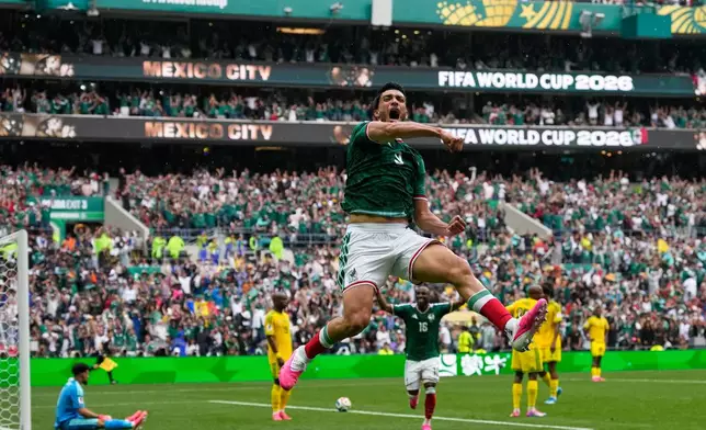 Mexico's Raul Jimenez celebrates after scoring his side's second goal during the World Cup Group A soccer match between Mexico and South Africa in Mexico City, Thursday, June 11, 2026. (AP Photo/Natacha Pisarenko)