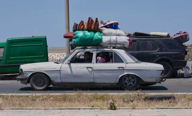 FILE - A Lebanese displaced family who fled their village in south Lebanon, arrive in the southern port city of Sidon, Lebanon, Wednesday, June 10, 2026. (AP Photo/Mohammed Zaatari, File)