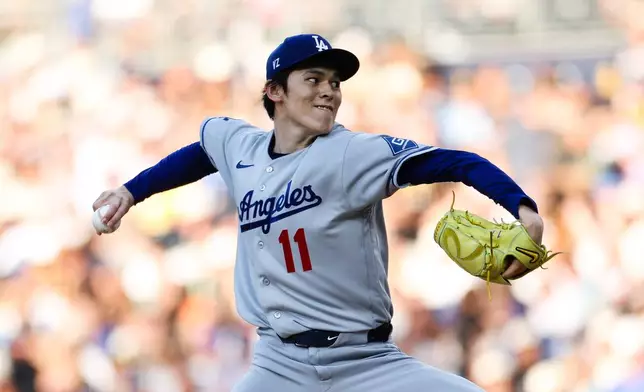 Los Angeles Dodgers' Roki Sasaki delivers a pitch against the San Diego Padres in the first inning of a baseball game Friday, June 26, 2026, in San Diego. (AP Photo/Derrick Tuskan)