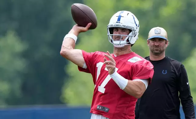 Indianapolis Colts quarterback Daniel Jones (17) throws during the NFL football team's practice in Indianapolis, Tuesday, June 9, 2026. (AP Photo/Michael Conroy)
