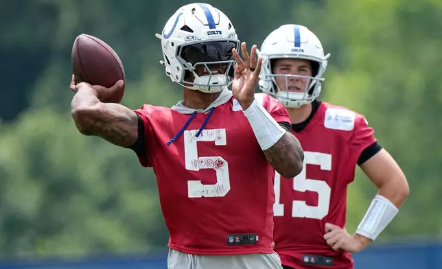 Indianapolis Colts quarterback Anthony Richardson Sr. (5) throws during the NFL football team's practice in Indianapolis, Tuesday, June 9, 2026. (AP Photo/Michael Conroy)