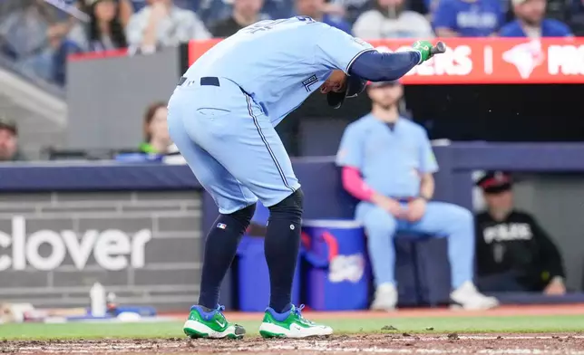 Toronto Blue Jays designated hitter George Springer (4) reacts after being struck out by Houston Astros pitcher Mike Burrows (50) during the sixth inning of a baseball game in Toronto on Wednesday, June 24, 2026. (Chris Young/The Canadian Press via AP)