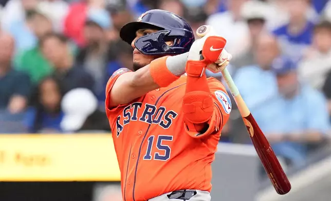 Houston Astros' Isaac Paredes (15) hits an RBI double against the Toronto Blue Jays during the first inning of a baseball game in Toronto on Wednesday, June 24, 2026. (Chris Young/The Canadian Press via AP)