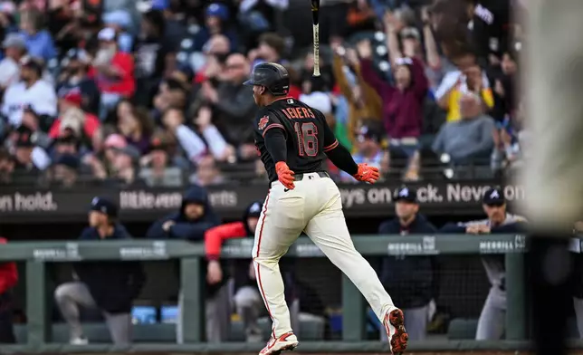 San Francisco Giants' Rafael Devers (16) flips his bat after hitting a three-run home run during the third inning of a baseball game Atlanta Braves, Saturday, June 27, 2026, in San Francisco (AP Photo/Justine Willard)