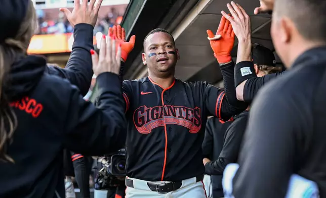 San Francisco Giants' Rafael Devers celebrates after hitting a solo home run during the second inning of a baseball game against the Atlanta Braves, Saturday, June 27, 2026, in San Francisco (AP Photo/Justine Willard)