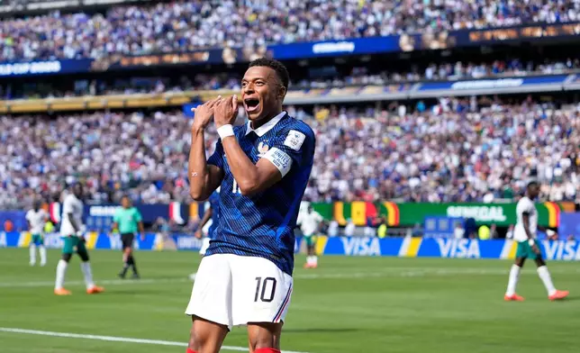 France's Kylian Mbappe celebrates after scoring the opening goal of his team during the World Cup Group I soccer match between France and Senegal in East Rutherford, N.J., near New York, Tuesday, June 16, 2026. (AP Photo/Frank Franklin II)