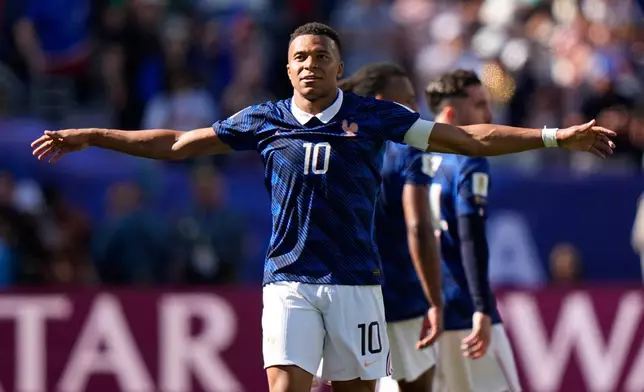 France's Kylian Mbappe celebrates after scoring his side's third goal during the World Cup Group I soccer match between France and Senegal in East Rutherford, N.J., near New York, Tuesday, June 16, 2026. (AP Photo/Frank Franklin II)