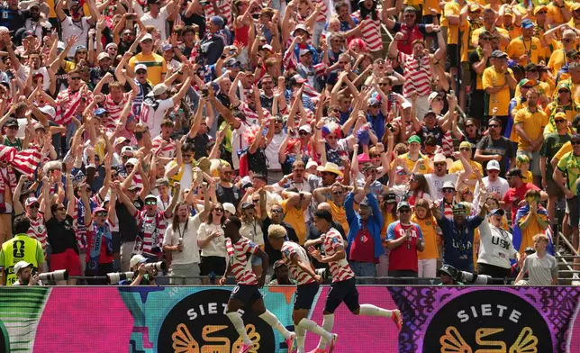 US players celebrate the opening goal of their team during the World Cup Group D soccer match between the United States and Australia in Seattle, Friday, June 19, 2026. (AP Photo/Abbie Parr)