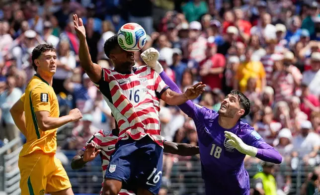 Australia goalkeeper Patrick Beach fails to stop a goal by United States' Alex Freeman, center, during the World Cup Group D soccer match between the United States and Australia in Seattle, Friday, June 19, 2026. (AP Photo/Lindsey Wasson)