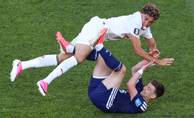 Morocco's Neil El Aynaoui (24) and Scotland's Kieran Tierney (60 collide during the World Cup Group C soccer match between Scotland and Morocco in Foxborough, Mass., near Boston, Friday, June 19, 2026. (AP Photo/Mark Stockwell)