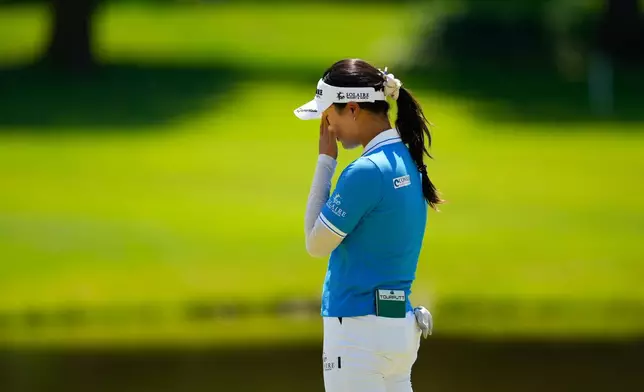 Ina Yoon, of South Korea, reacts after missing her shot on the sixth green during the third round of the Women's PGA Championship golf tournament at Hazeltine National Golf Club, Saturday, June 27, 2026, in Chaska,Minn. (AP Photo/Matt York)