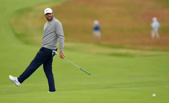 Scottie Scheffler reacts after missing a putt on the third hole during the first round of the U.S. Open golf tournament at Shinnecock Hills Golf Club in Southampton, N.Y., Thursday, June 18, 2026.(AP Photo/David J. Phillip)