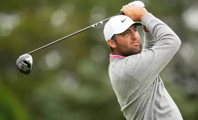 Scottie Scheffler watches his tee shot on the sixth hole during the first round of the U.S. Open golf tournament at Shinnecock Hills Golf Club in Southampton, N.Y., Thursday, June 18, 2026.(AP Photo/Seth Wenig)