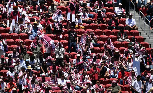 Fans watch from the stands during the World Cup Group B soccer match between Qatar and Switzerland in Santa Clara, Calif., near San Francisco, Saturday, June 13, 2026. (AP Photo/Eakin Howard)