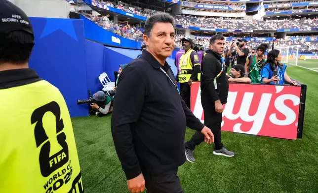 Iran head coach Amir Ghalenoei walks on the field before the World Cup Group G soccer match between Iran and New Zealand in Inglewood, Calif., near Los Angeles, Monday, June 15, 2026. (AP Photo/Mark J. Terrill)