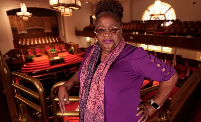 Lisa McNair poses for a photo inside 16th Street Baptist Church, the site of the Sept. 15, 1963 terrorist bombing of the church, Monday, June 1, 2026, in Birmingham, Ala. (AP Photo/Mike Stewart)