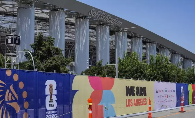 Fencing with FIFA World Cup 2026 signage stands outside SoFi Stadium in Inglewood, Calif., Monday, June 1, 2026. (AP Photo/Jae C. Hong)