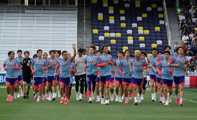 The Japan national team jogs around the pitch during a training session Monday, June 8, 2026, in Nashville, Tenn., ahead of the World Cup soccer tournament. (AP Photo/George Walker IV)