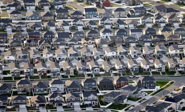 FILE - This April 13, 2019, photo, shows rows of homes, in suburban Salt Lake City. (AP Photo/Rick Bowmer, File)