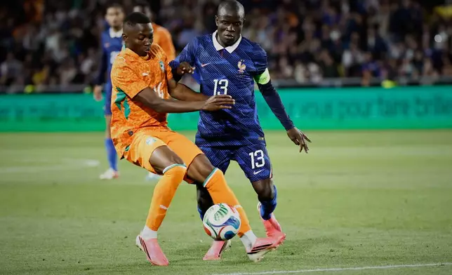 France's N'Golo Kante, right, challenges for the ball with Ivory Coast's Bazoumana Toure during the international friendly soccer match between France and Ivory Coast in Nantes, France, Thursday, June 4, 2026. (AP Photo/Jeremias Gonzalez)
