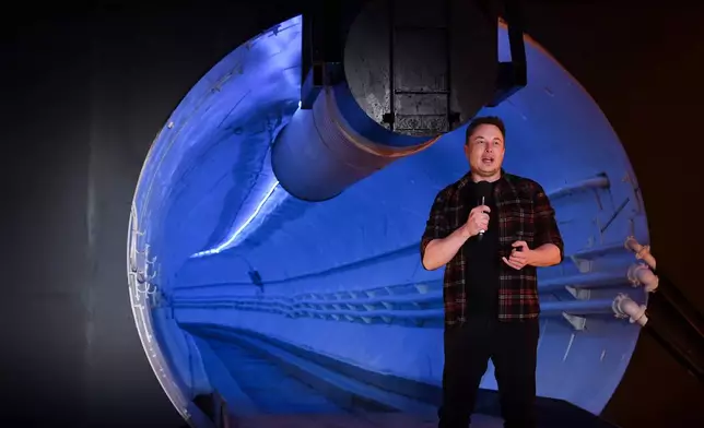 FILE - Elon Musk, co-founder and chief executive officer of Tesla Inc., speaks during an unveiling event for the Boring Co. Hawthorne test tunnel in Hawthorne, Calif., on Tuesday, Dec. 18, 2018. (Robyn Beck/Pool Photo via AP, File)