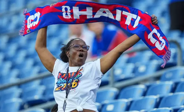 A Haiti supporter reacts ahead of the World Cup Group C soccer match between Haiti and Scotland in Foxborough, Mass., near Boston, Saturday, June 13, 2026. (AP Photo/Martin Meissner)