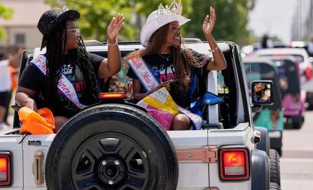 FILE - People participate during a Juneteenth parade, June 19, 2025, in Galveston, Texas. (AP Photo/David J. Phillip, File)