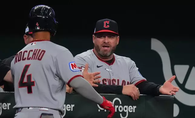 Cleveland Guardians manager Stephen Vogt, right, congratulates Brayan Rocchio (4) after Rocchio hit a home run during the fifth inning of a baseball game against the Texas Rangers, Saturday, June 6, 2026, in Arlington, Texas. (AP Photo/LM Otero)