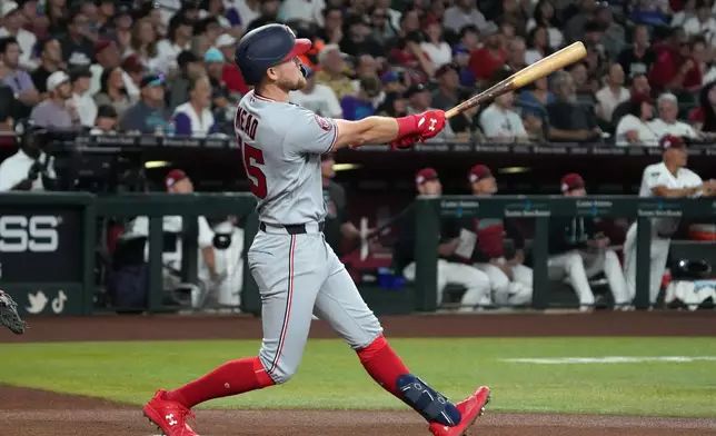 Washington Nationals' Curtis Mead hits a two-run home run against the Arizona Diamondbacks in the first inning of a baseball game, Saturday, June 6, 2026, in Phoenix. (AP Photo/Rick Scuteri)