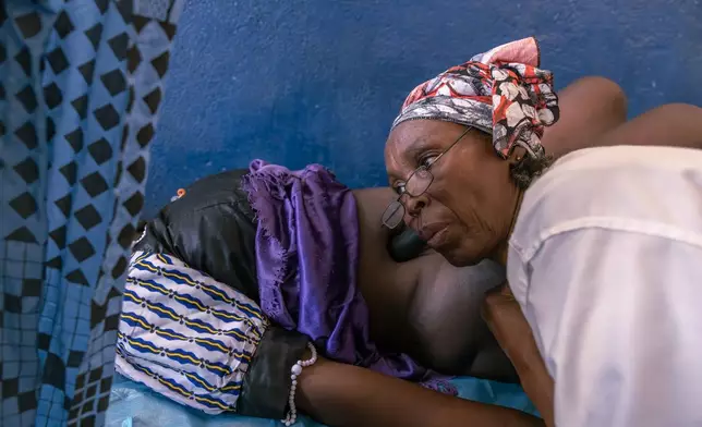 A woman has her first pre-natal consultation with nurse Delphine Zanabe at the Birao District Hospital in Central African Republic, Thursday, March 26, 2026. (AP Photo/Caitlin Kelly)