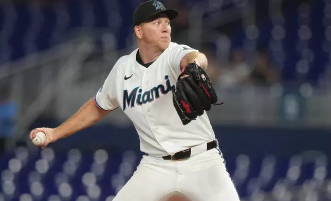 Miami Marlins pitcher Ryan Gusto aims a pitch during the first inning of a baseball game against the Arizona Diamondbacks Wednesday, June 10, 2026, in Miami. (AP Photo/Marta Lavandier)